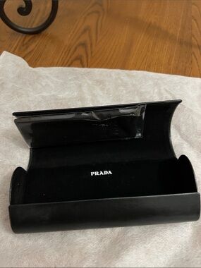 Prada leather Black Eyewear Case with White Logo and cleaning cloth.
